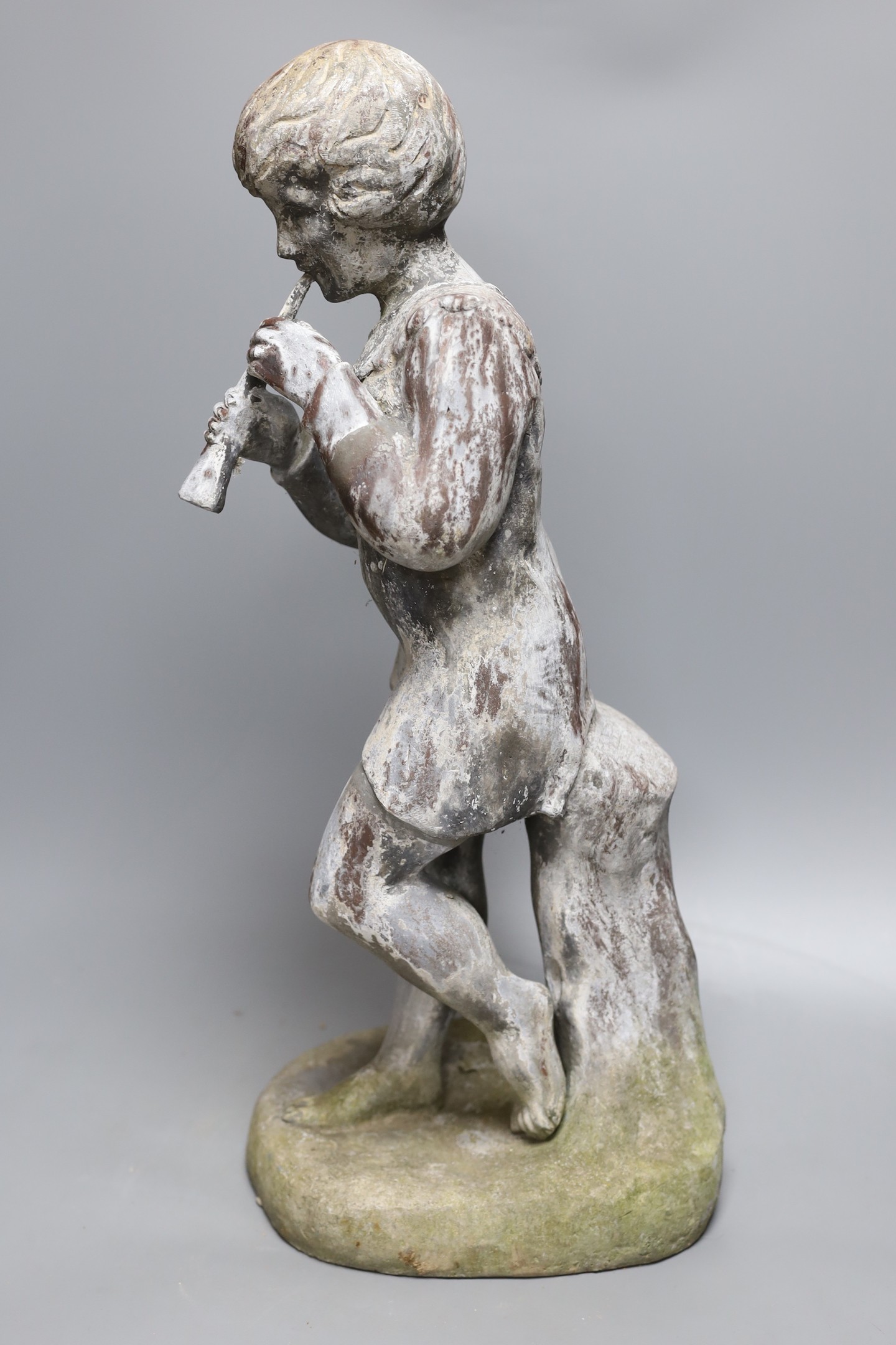 A 20th century lead garden statue of Pan, 58cms high.